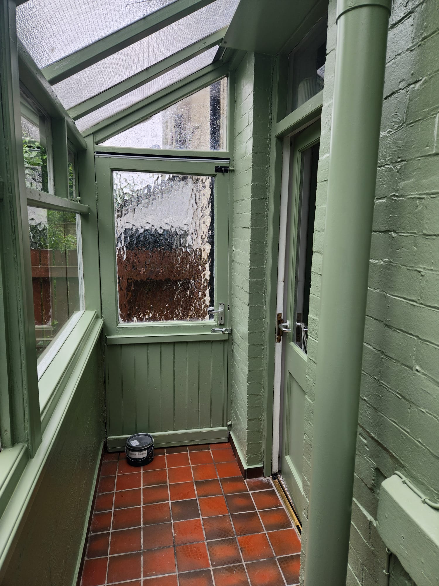Conservatory freshly painted in soft green